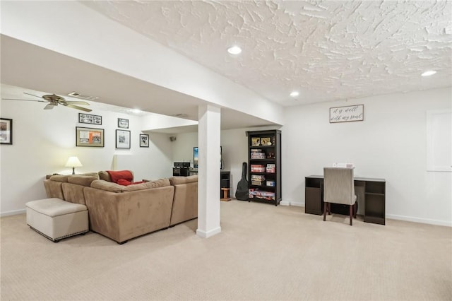 carpeted living room with ceiling fan and a textured ceiling