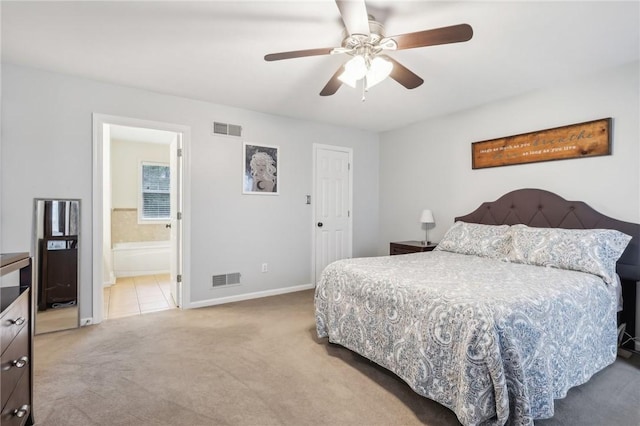 bedroom featuring carpet, connected bathroom, and ceiling fan