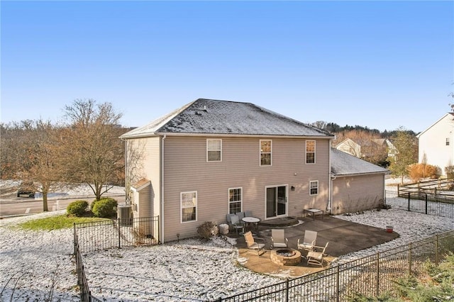 back of house featuring central AC, a fire pit, and a patio area