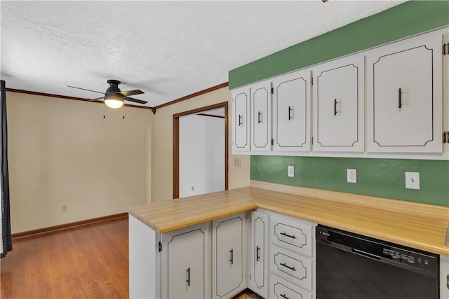 kitchen featuring white cabinetry, dishwasher, ceiling fan, light wood-type flooring, and ornamental molding