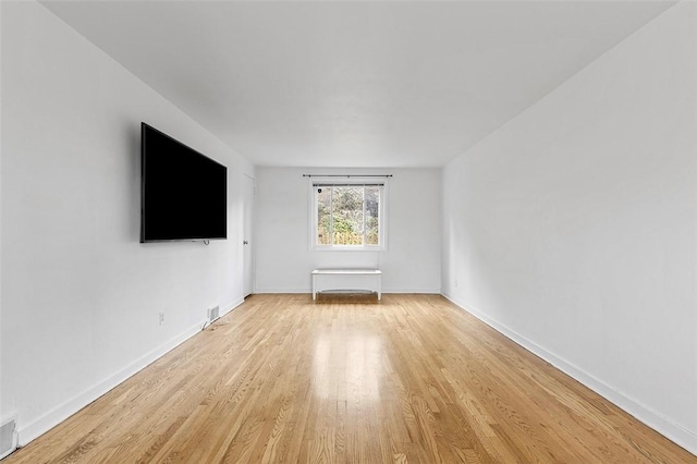 unfurnished living room featuring light hardwood / wood-style floors