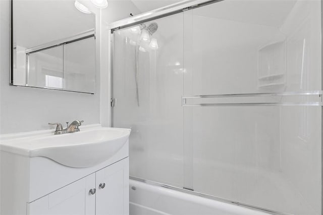 bathroom featuring vanity and bath / shower combo with glass door