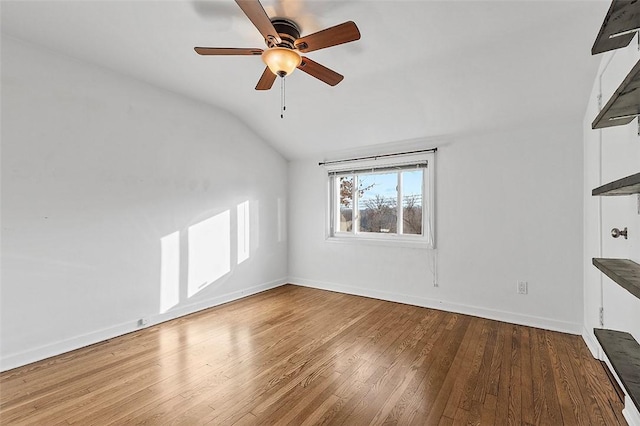 unfurnished living room with ceiling fan, baseboards, wood finished floors, and lofted ceiling
