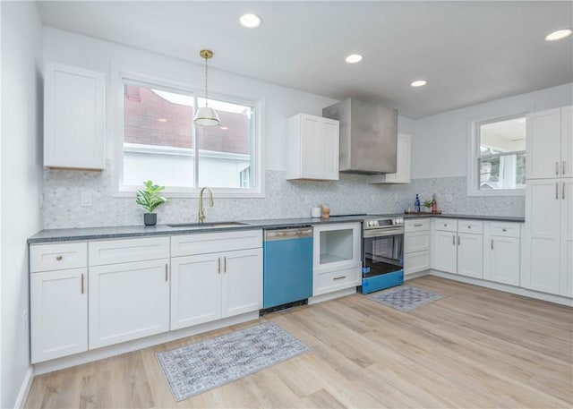 520 Washington St, Bentleyville, PA 15314 - kitchen with dishwashing machine, stainless steel electric stove, white cabinetry, hanging light fixtures, and recessed lighting