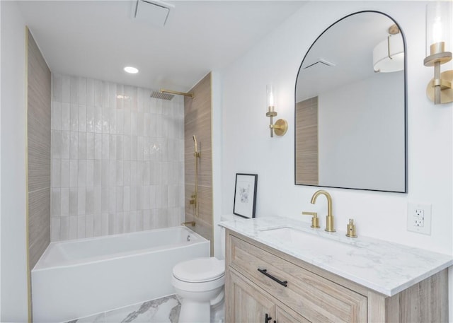 full bathroom with tiled shower / bath combo, toilet, and vanity