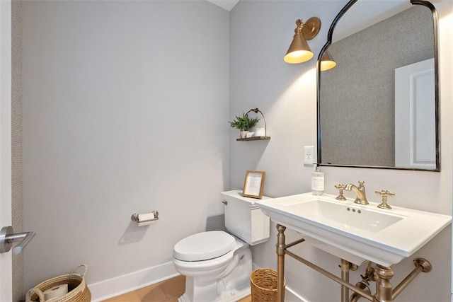 bathroom featuring tile patterned flooring and toilet