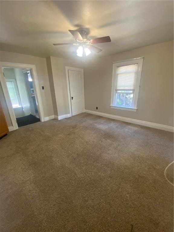 carpeted empty room with ceiling fan