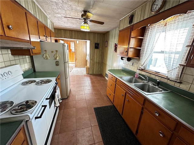 kitchen with sink, electric range, ceiling fan, tile patterned flooring, and tasteful backsplash