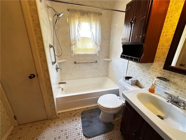 full bathroom with shower / bathing tub combination, tile patterned flooring, toilet, and vanity