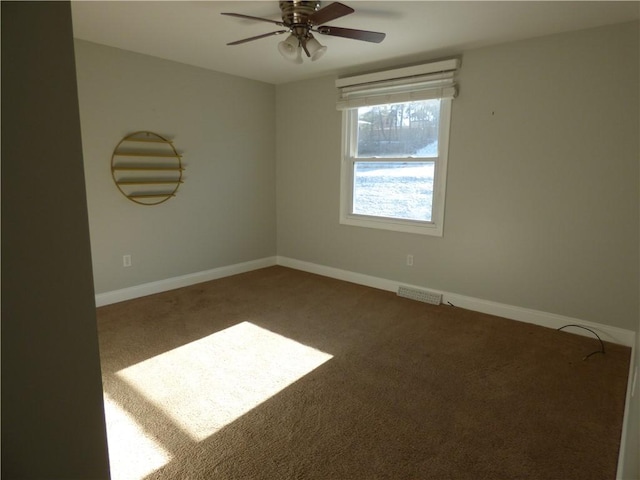 empty room with carpet flooring and ceiling fan