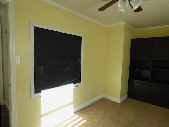 unfurnished bedroom with ceiling fan, a closet, light carpet, and ornamental molding