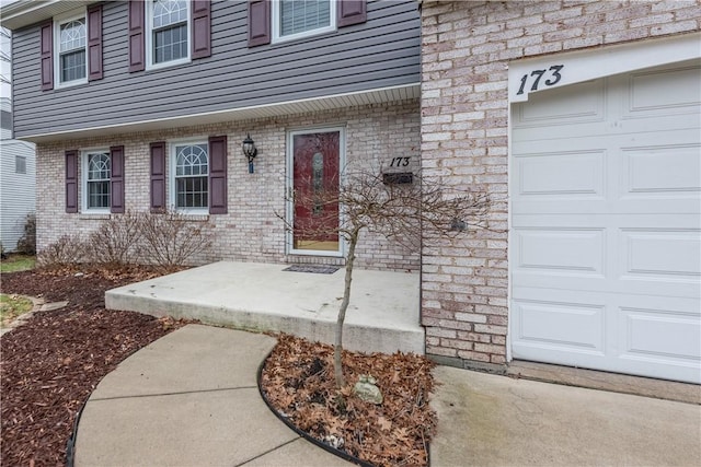 view of exterior entry featuring a garage