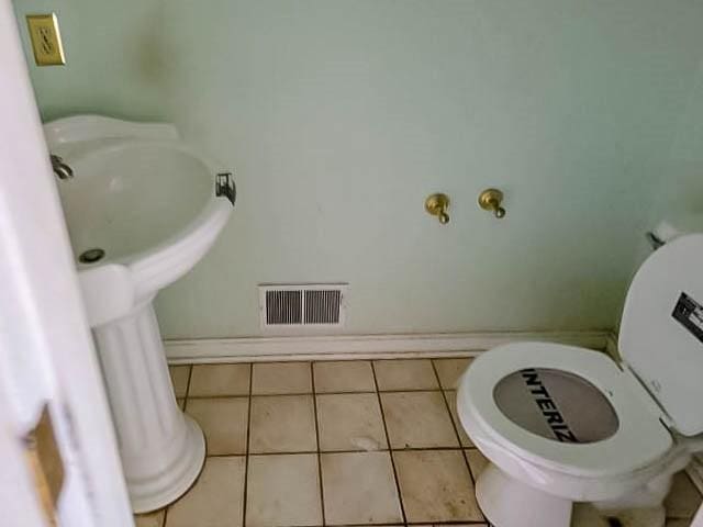 bathroom featuring tile patterned flooring and toilet