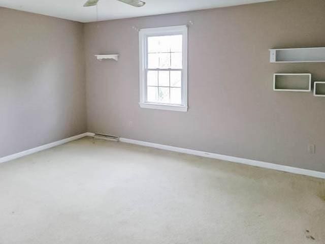 unfurnished room featuring carpet flooring and ceiling fan