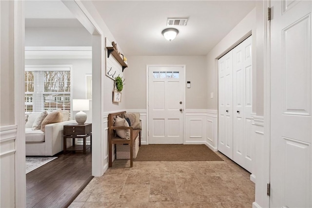 entryway with light hardwood / wood-style flooring