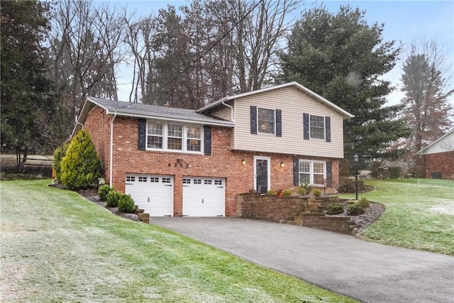 view of front of home with a garage and a front yard