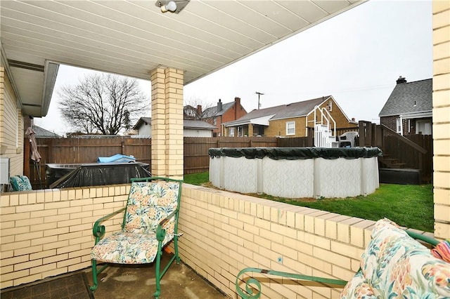 view of patio / terrace featuring a covered pool