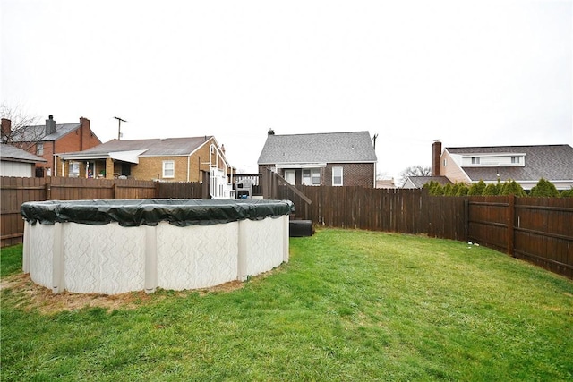 view of yard featuring a covered pool