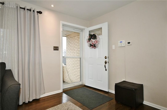 foyer with dark wood-type flooring