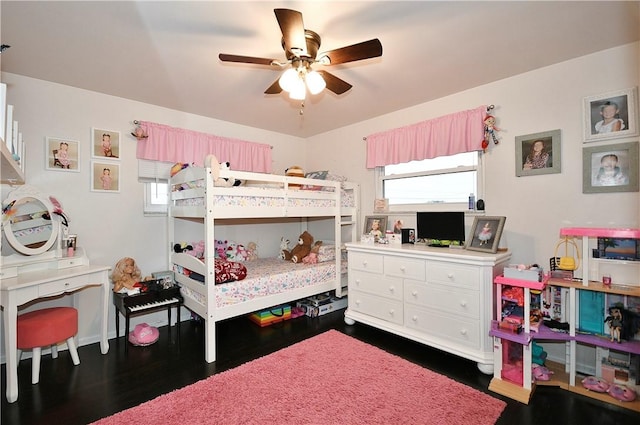 bedroom featuring ceiling fan and dark hardwood / wood-style floors