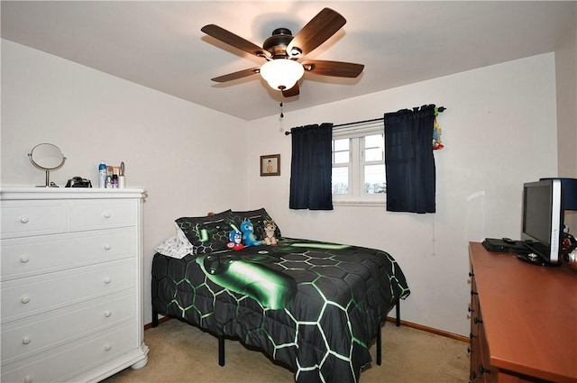 bedroom with light carpet and ceiling fan