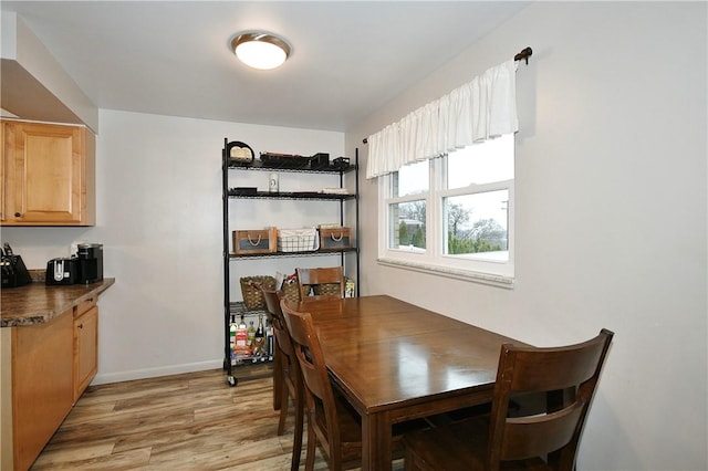 dining space featuring light hardwood / wood-style flooring