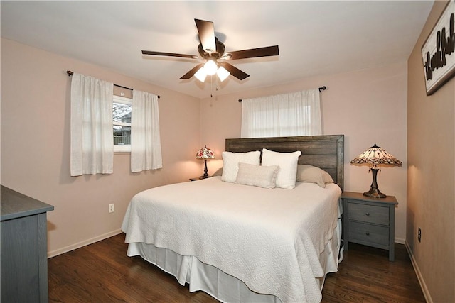 bedroom with ceiling fan and dark hardwood / wood-style flooring