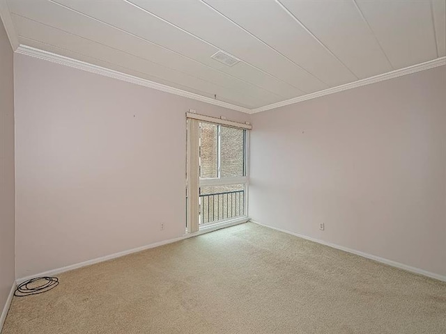 carpeted empty room featuring ornamental molding