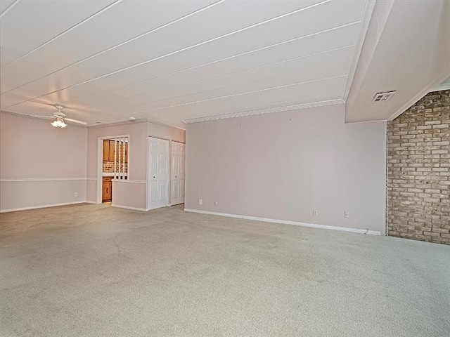 unfurnished living room featuring ceiling fan and light carpet