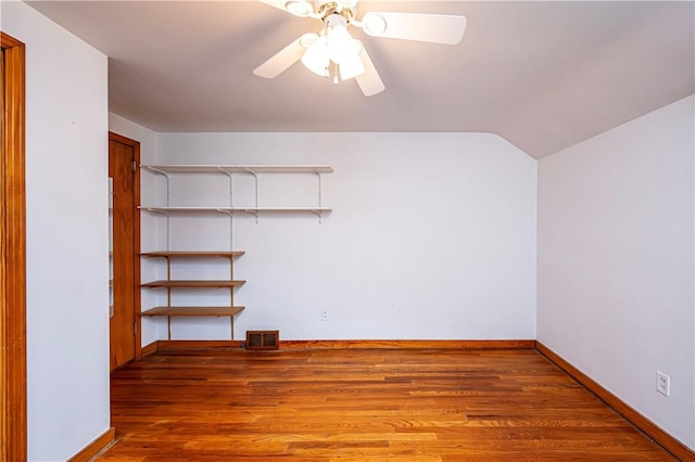 interior space with ceiling fan and wood-type flooring