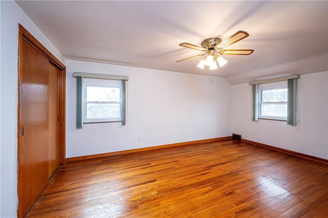 empty room with wood-type flooring and ceiling fan