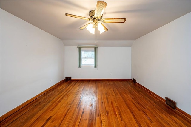 spare room featuring ceiling fan and hardwood / wood-style flooring