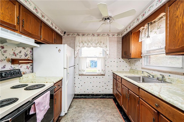 kitchen featuring ceiling fan, sink, and white electric stove