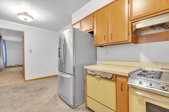 kitchen with ventilation hood and appliances with stainless steel finishes