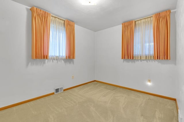 spare room with carpet