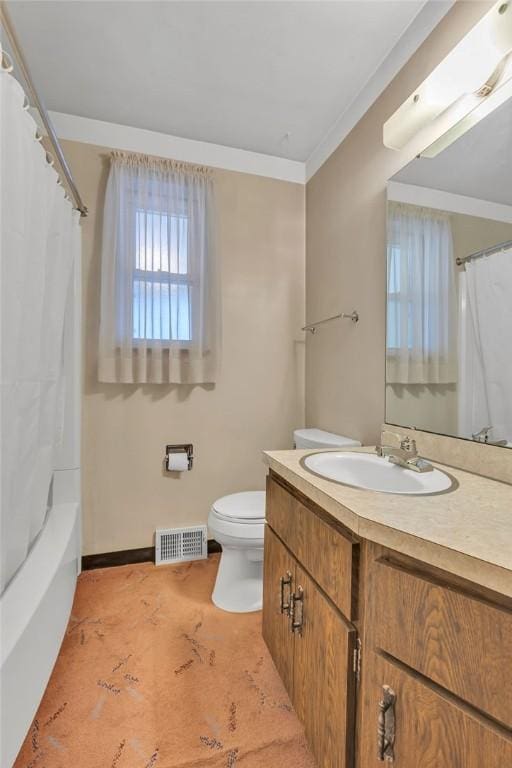 full bathroom featuring vanity, ornamental molding, shower / bath combo, and toilet