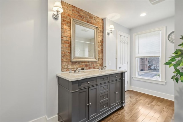 bathroom with vanity and hardwood / wood-style flooring