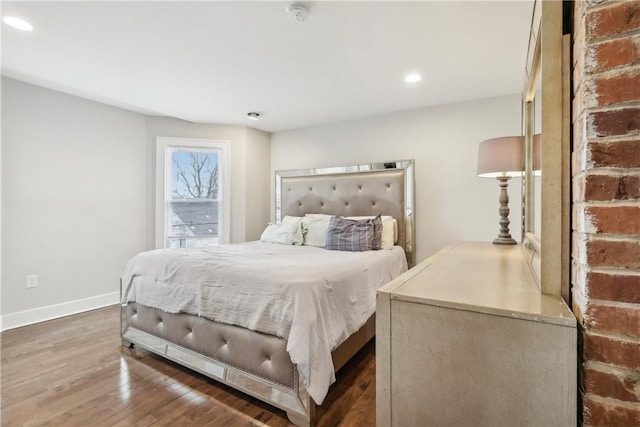 bedroom with hardwood / wood-style floors