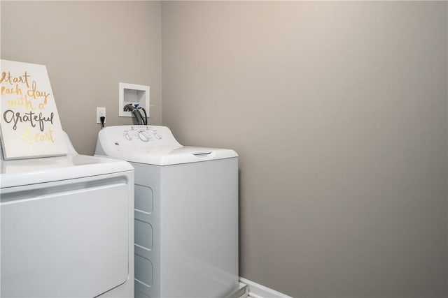 clothes washing area with independent washer and dryer