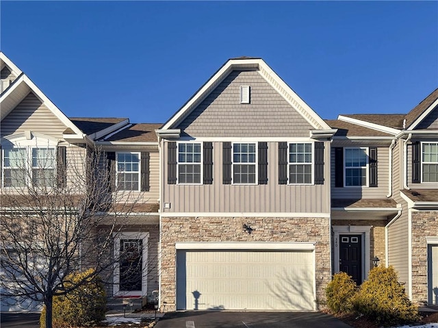 townhome / multi-family property featuring a garage