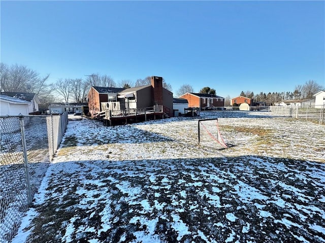 view of yard layered in snow