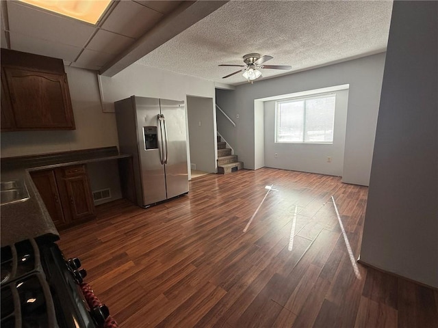 interior space featuring stainless steel fridge with ice dispenser, dark hardwood / wood-style flooring, ceiling fan, and dark brown cabinets