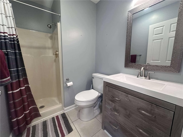 bathroom with tile patterned flooring, vanity, curtained shower, and toilet