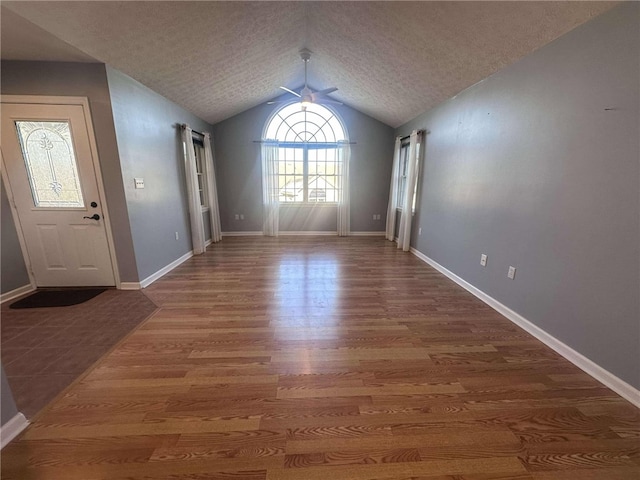 interior space featuring vaulted ceiling and hardwood / wood-style flooring