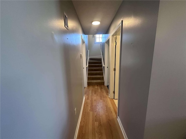 hall with light hardwood / wood-style floors