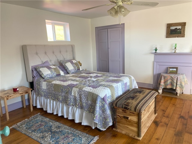 bedroom with ceiling fan and hardwood / wood-style floors