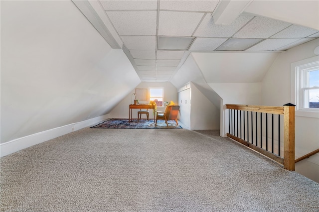 bonus room with carpet floors and lofted ceiling