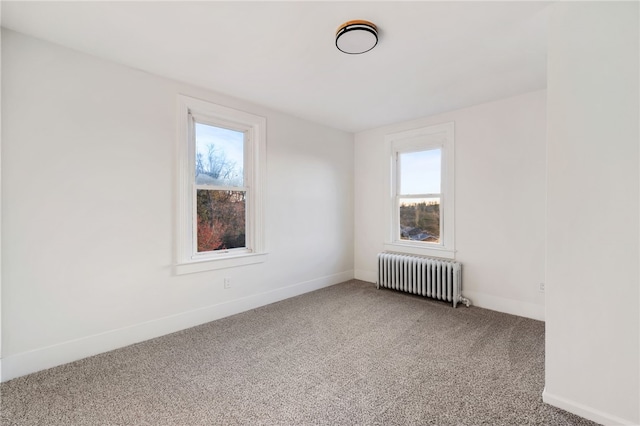 carpeted spare room with radiator