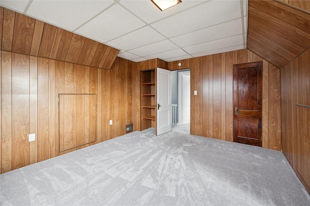 interior space featuring wooden walls