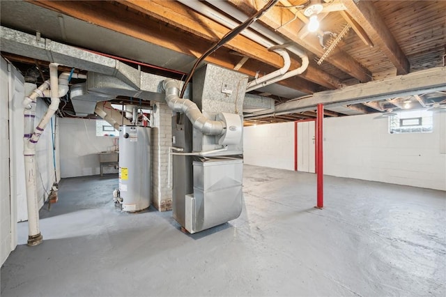 basement with gas water heater and heating unit